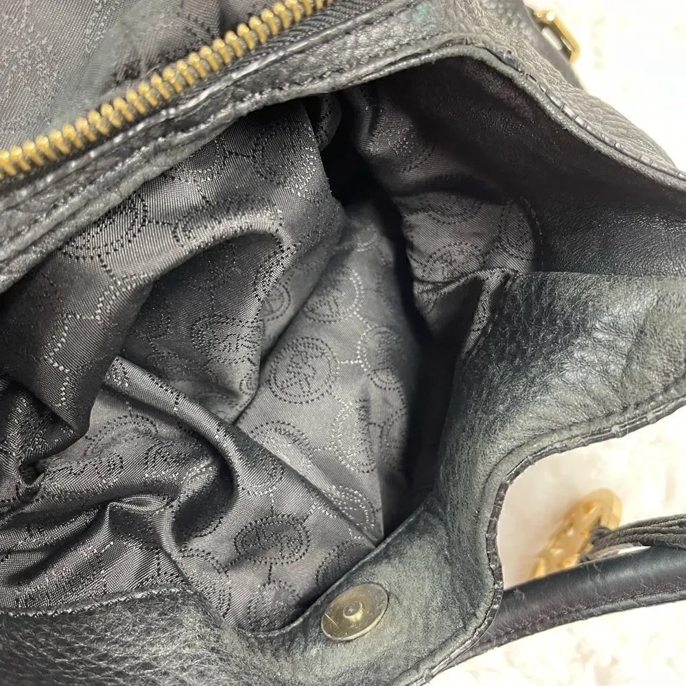 Michael Kors Black Pebble Leather Satchel with gold tone hardwares and accents.